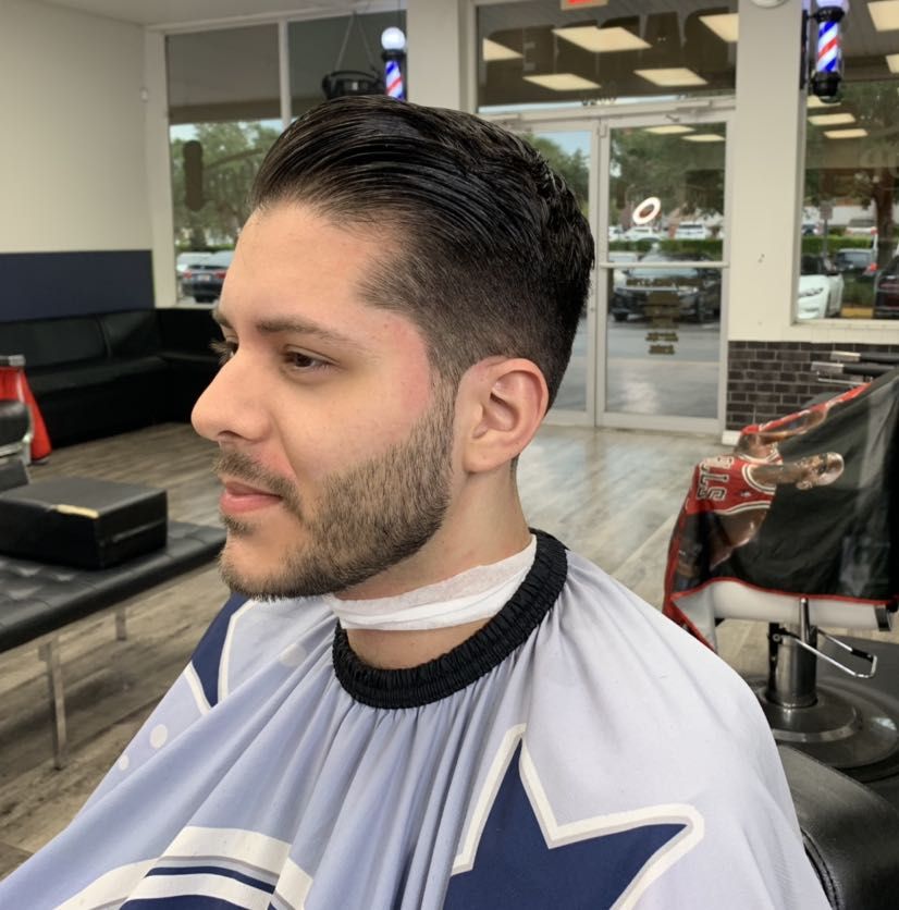 Side profile of a finished haircut and beard trim by Pedro